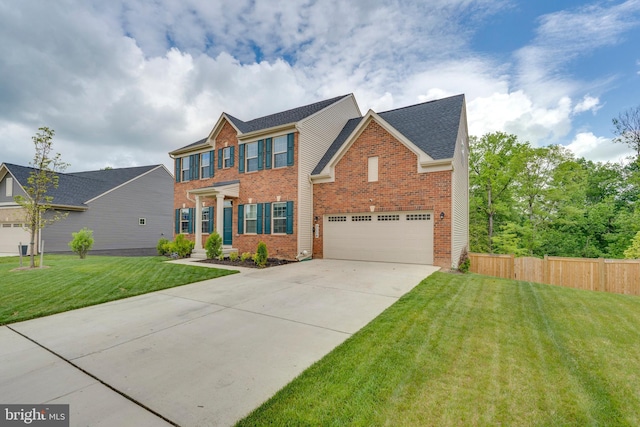 view of front of house with a garage and a front yard