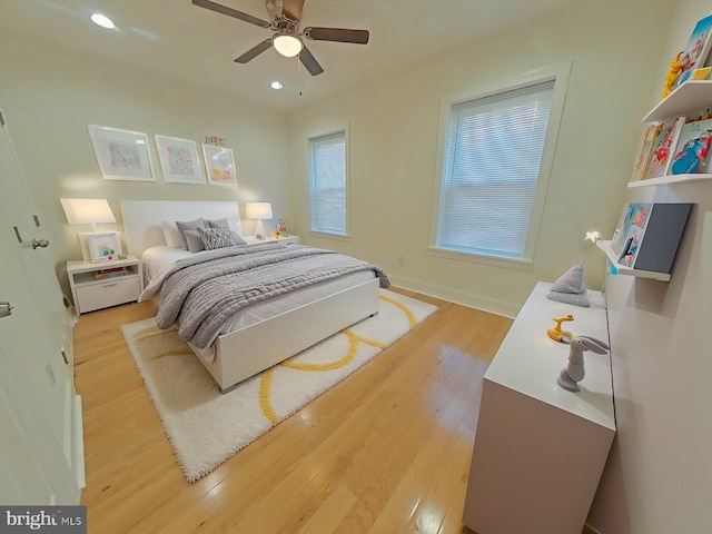 bedroom featuring light hardwood / wood-style flooring and ceiling fan