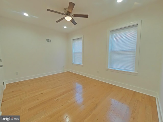 unfurnished room featuring light hardwood / wood-style floors and ceiling fan