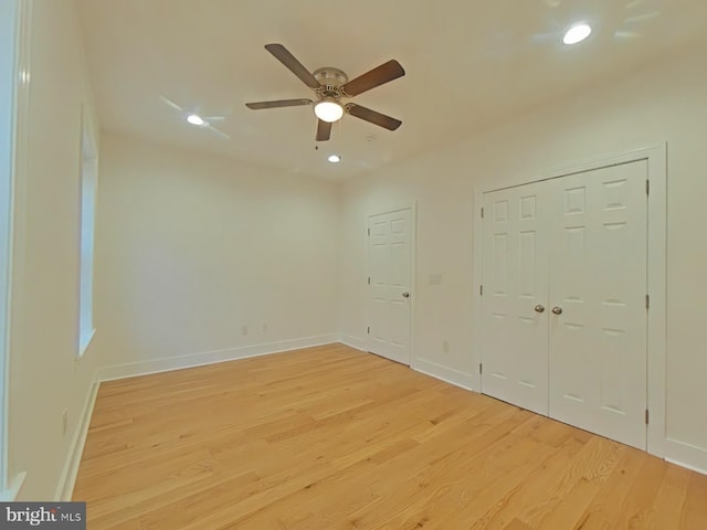 unfurnished bedroom featuring ceiling fan and light hardwood / wood-style flooring