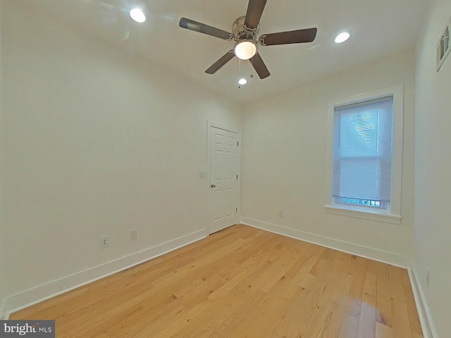 spare room featuring ceiling fan and light hardwood / wood-style flooring