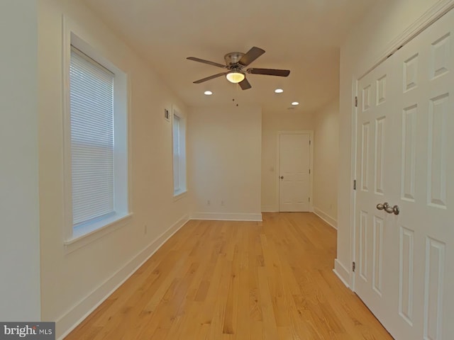 unfurnished room featuring ceiling fan and light hardwood / wood-style floors