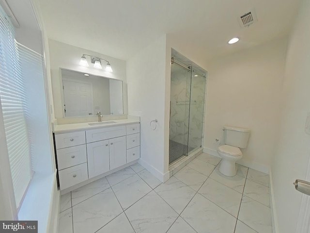 bathroom featuring vanity, toilet, and walk in shower