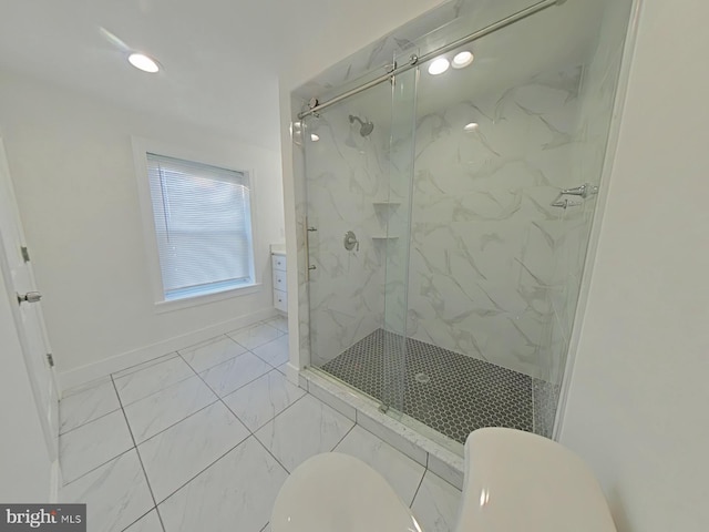 bathroom featuring toilet and an enclosed shower