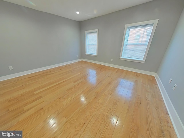 spare room featuring light wood-type flooring