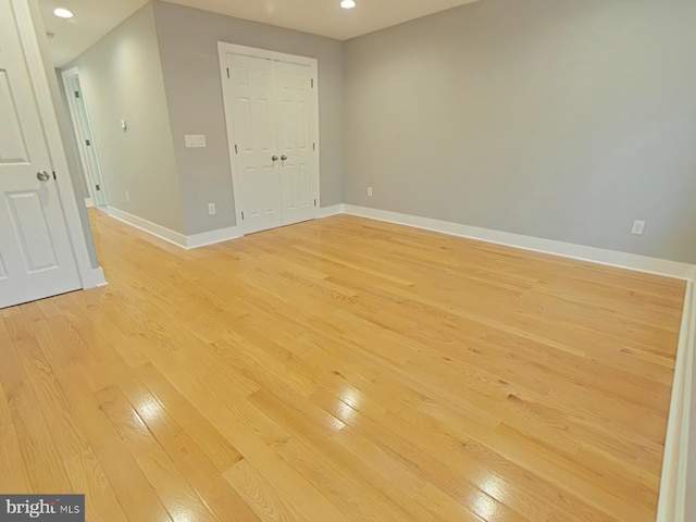 empty room with light hardwood / wood-style floors