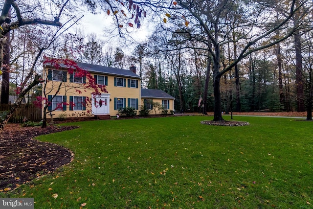 colonial home with a front yard