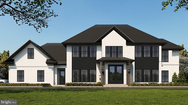 view of front facade featuring a front yard and french doors