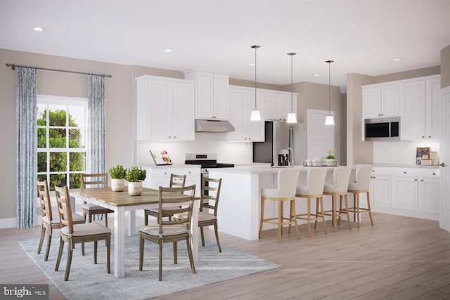 dining space featuring light hardwood / wood-style floors