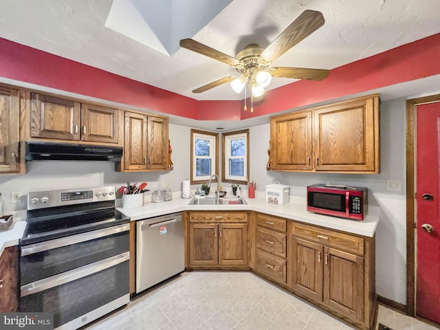 kitchen with ceiling fan, sink, and stainless steel appliances