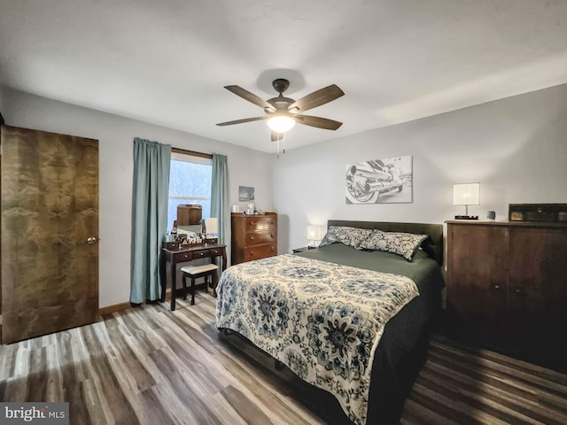 bedroom featuring ceiling fan and hardwood / wood-style floors