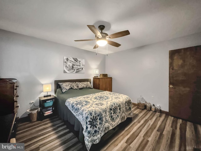 bedroom with hardwood / wood-style flooring and ceiling fan