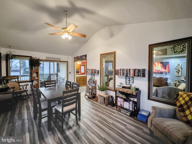 dining room featuring hardwood / wood-style floors, ceiling fan, and lofted ceiling