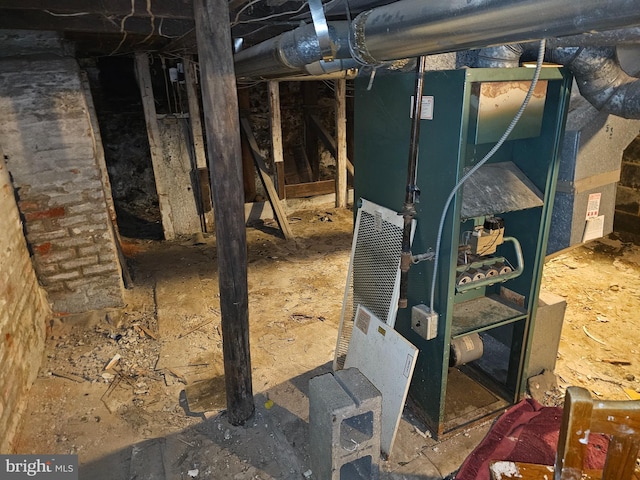 utility room featuring heating unit