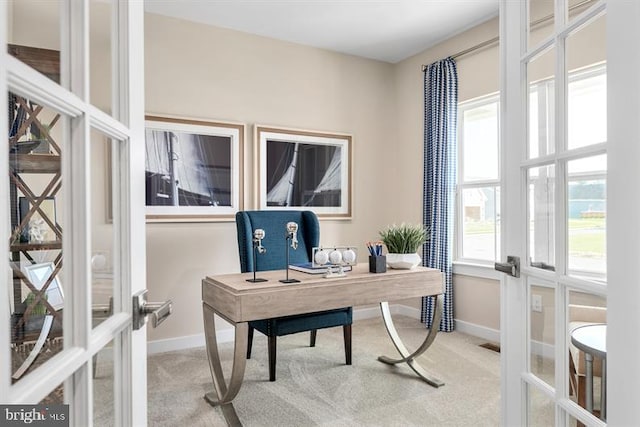 home office with light colored carpet and french doors