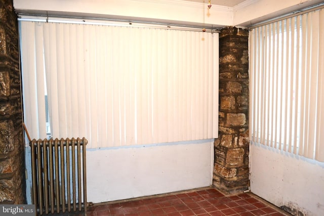 empty room featuring radiator heating unit