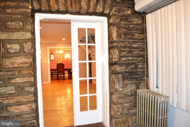 entrance to property featuring radiator heating unit