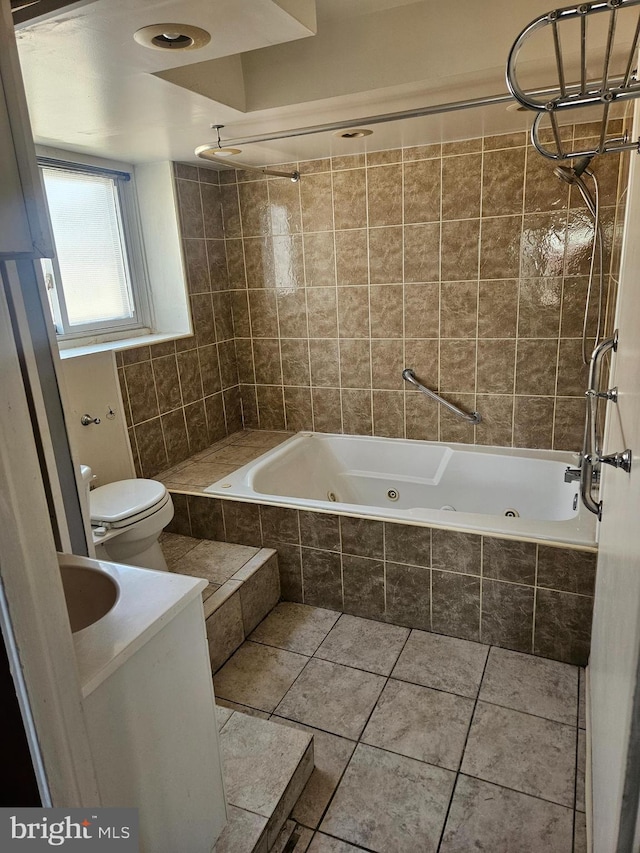 full bath with tile patterned flooring, toilet, and a combined bath / shower with jetted tub