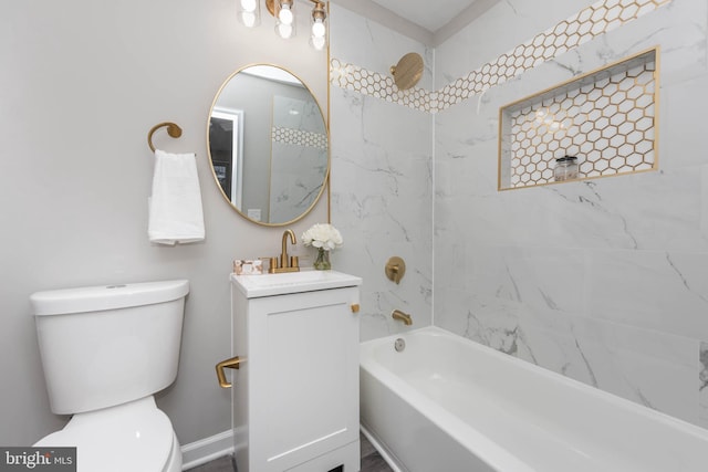 full bathroom with vanity, toilet, and tiled shower / bath