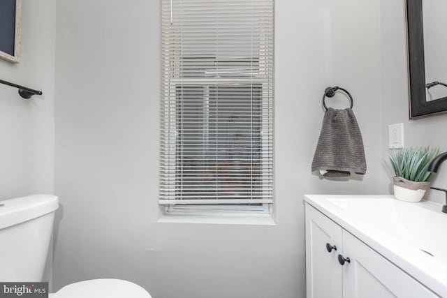 bathroom featuring vanity and toilet