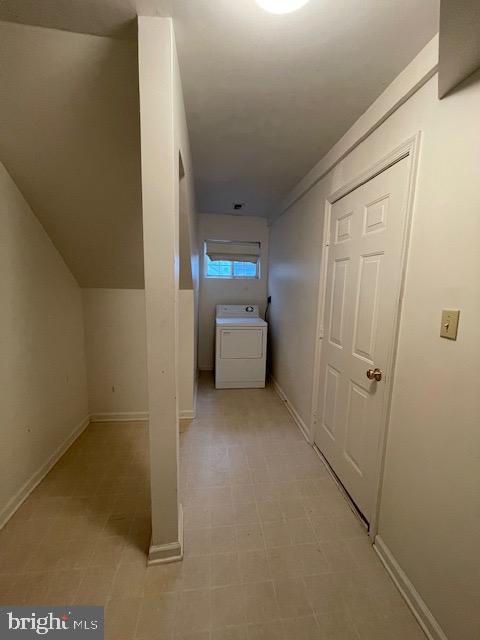 hallway with washer / dryer