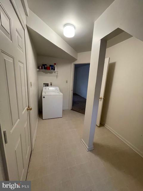 washroom featuring washer / dryer