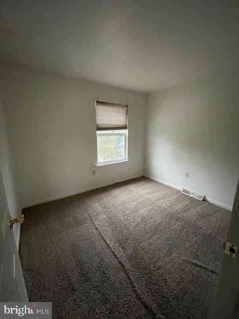 empty room featuring carpet floors