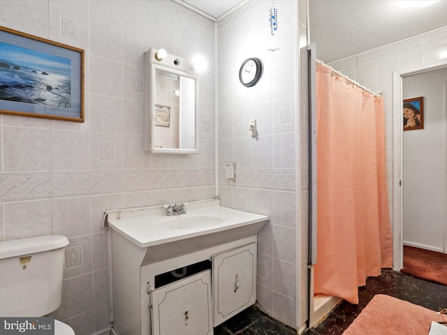 bathroom with walk in shower, toilet, vanity, tile walls, and ornamental molding