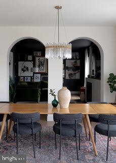 dining room featuring hardwood / wood-style flooring and a notable chandelier