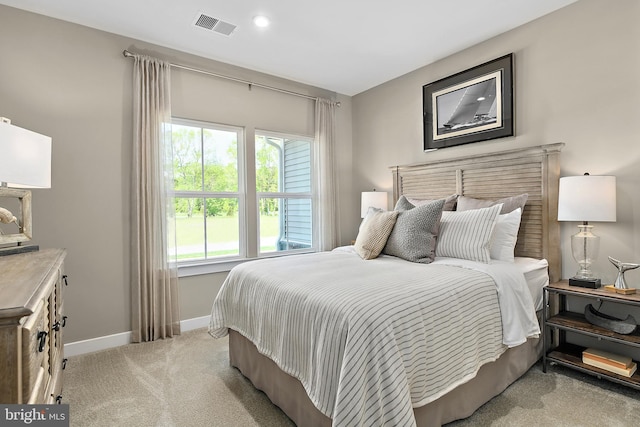 bedroom featuring light carpet