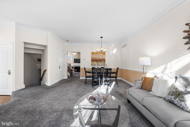 living room featuring carpet, a notable chandelier, and crown molding