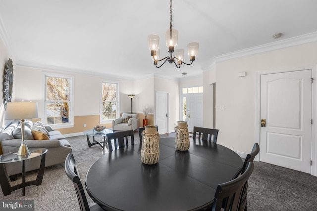 dining space featuring crown molding, carpet, and a notable chandelier