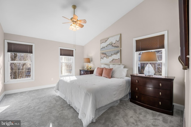 bedroom with light colored carpet, ceiling fan, and lofted ceiling