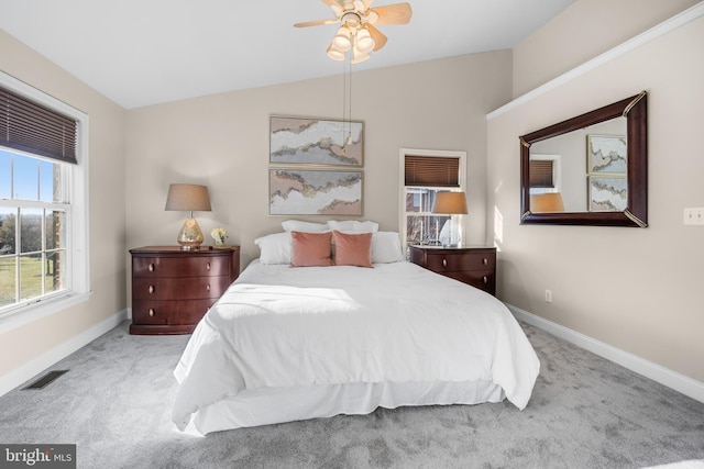 carpeted bedroom featuring ceiling fan and lofted ceiling