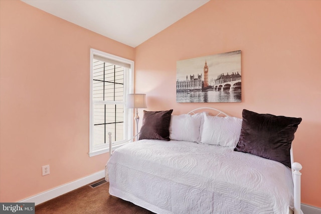 bedroom featuring carpet flooring and lofted ceiling