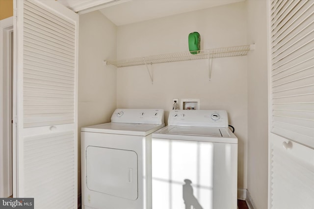 clothes washing area with washer and dryer