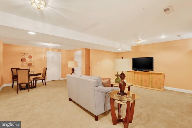 living room featuring light carpet