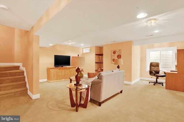 living room featuring light colored carpet