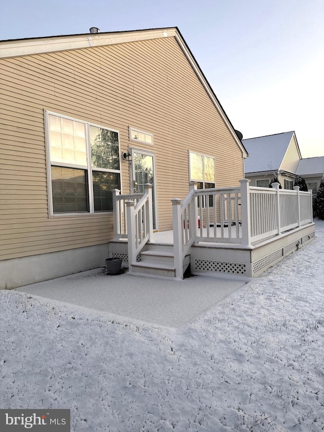 back of house with a wooden deck