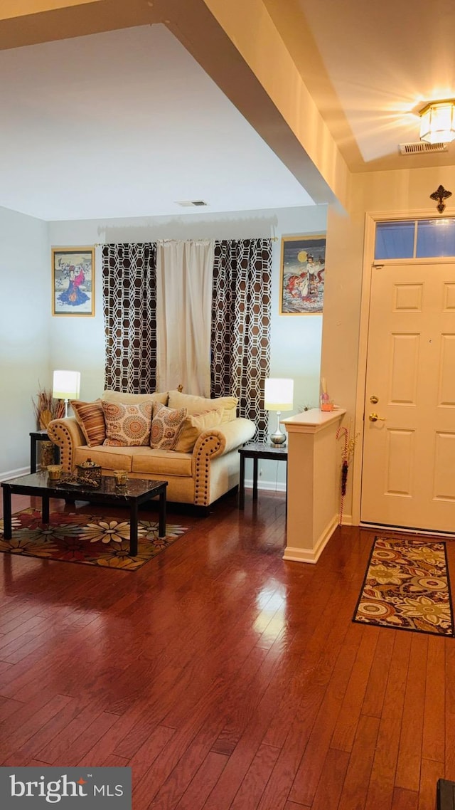 foyer entrance featuring dark hardwood / wood-style floors