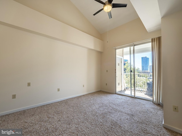 empty room with carpet, high vaulted ceiling, and ceiling fan