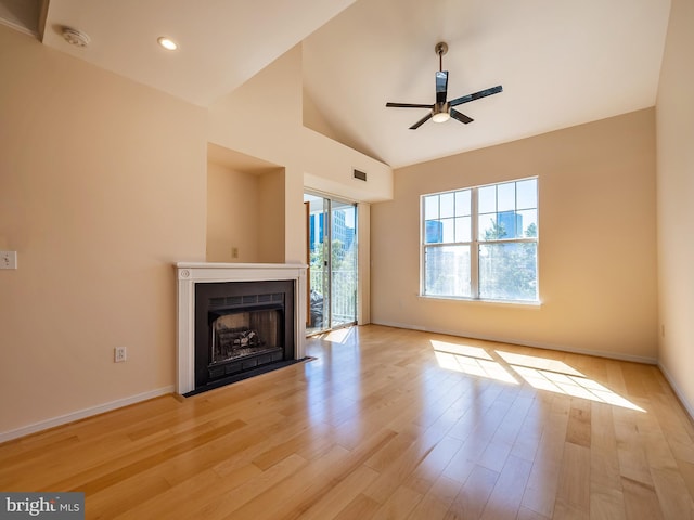 unfurnished living room with ceiling fan, high vaulted ceiling, and light wood-type flooring