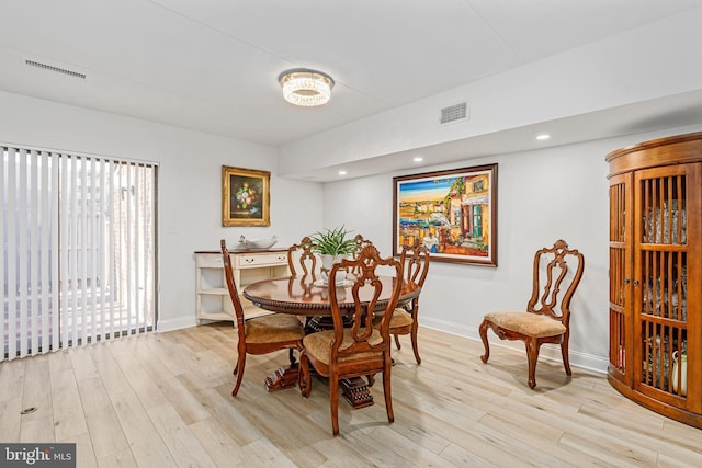 dining space with light wood-type flooring