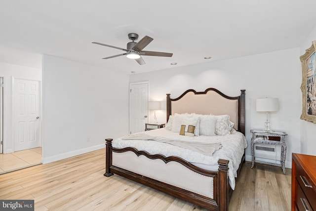 bedroom featuring light wood-type flooring and ceiling fan