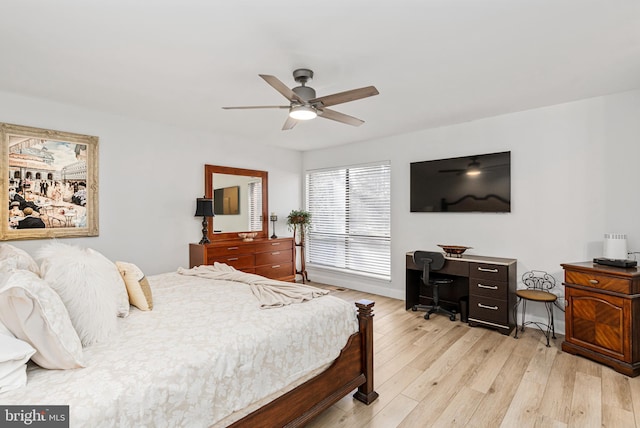 bedroom with ceiling fan and light hardwood / wood-style floors