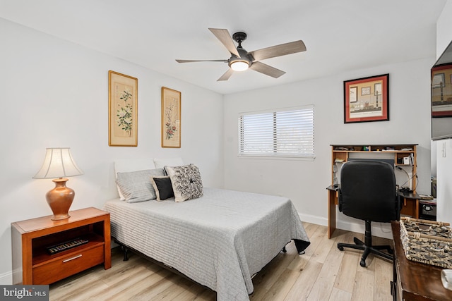 bedroom with light hardwood / wood-style floors and ceiling fan