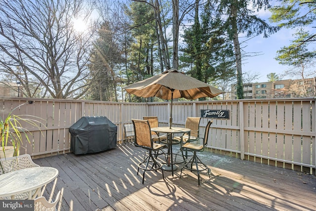 wooden deck featuring grilling area