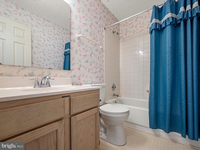 full bathroom with vanity, shower / bath combination with curtain, a textured ceiling, and toilet