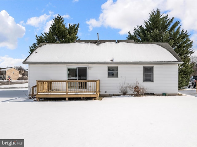 snow covered property featuring a deck