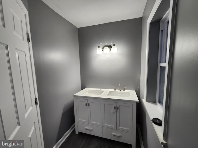 bathroom featuring vanity and hardwood / wood-style flooring